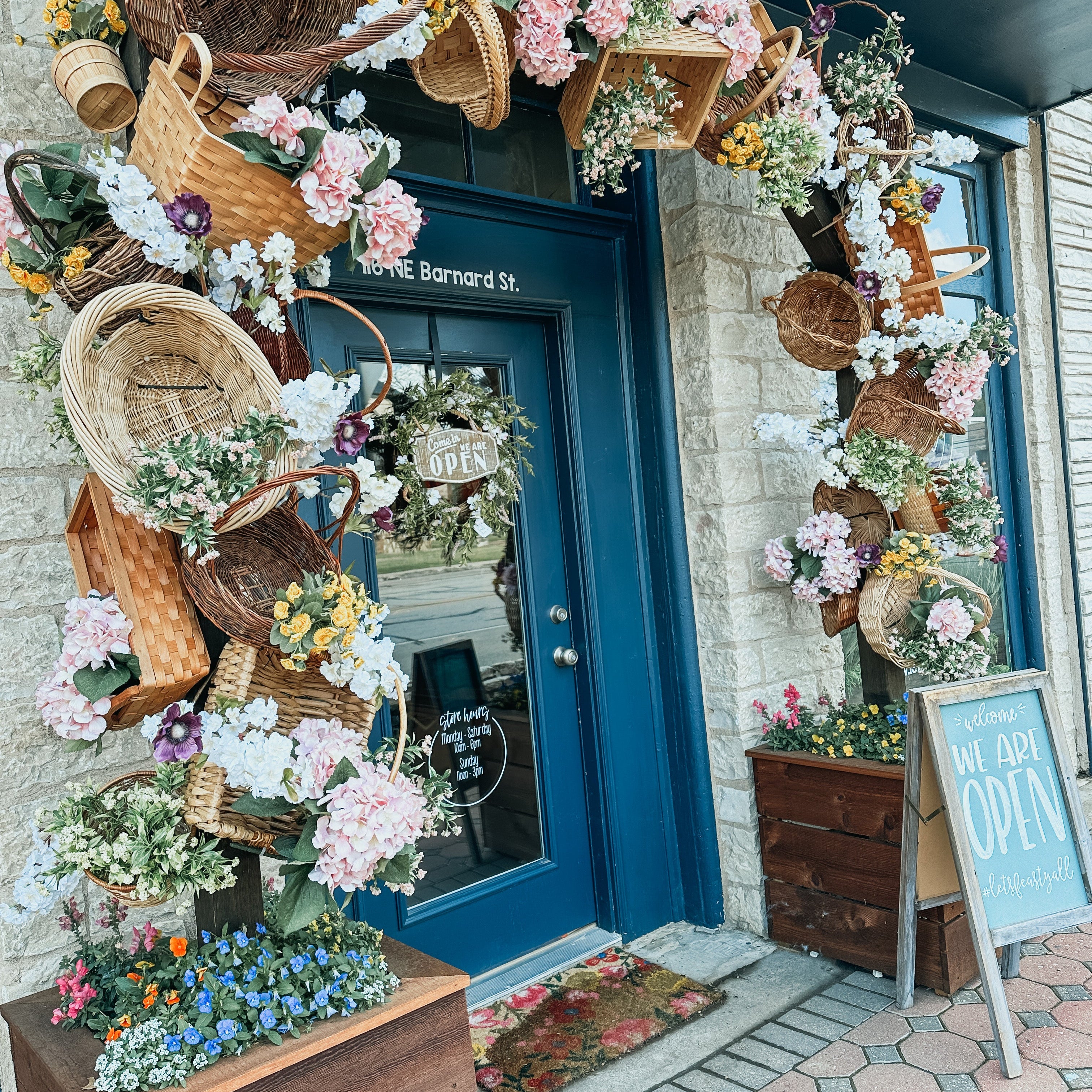 FEAST storefront with spring basket arbor decorations