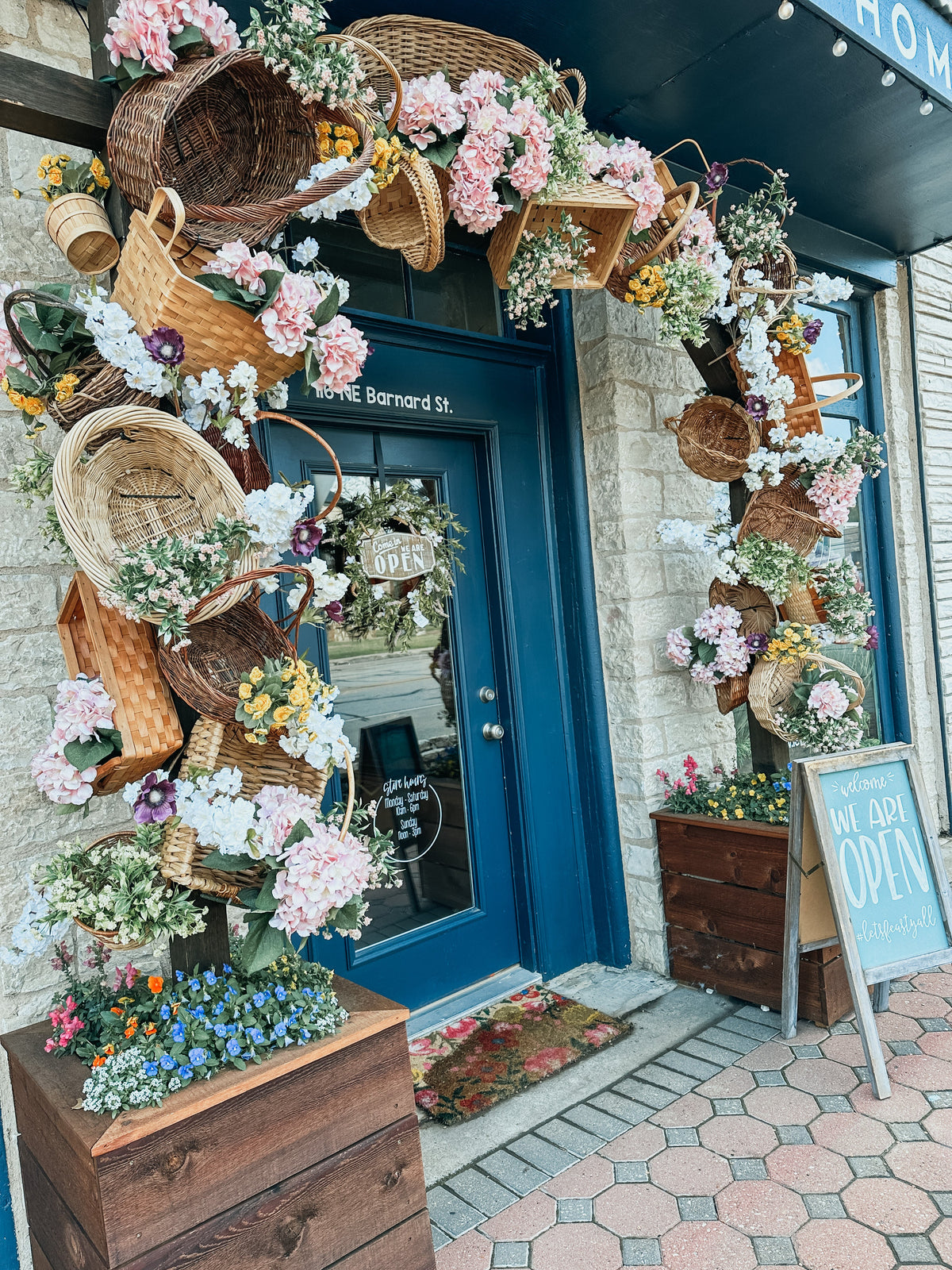 FEAST storefront with spring basket arbor decorations