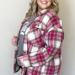 A cozy pink plaid flannel shirt shacket, perfect for chilly days.