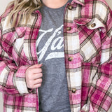 A cozy pink plaid flannel shirt shacket, perfect for chilly days.