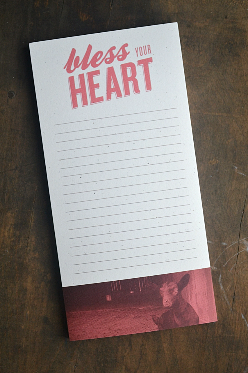A notepad with the words "Bless Your Heart" on it, ideal for lists, ideas, and reminders - a perfect gift option.