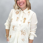 Ivy Jane ivory Milagro blouse, front view with rounded collar, bronze buttons and gathered placket detail.