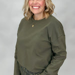 Entro army green long sleeve top with dropped shoulders and lace hem detail