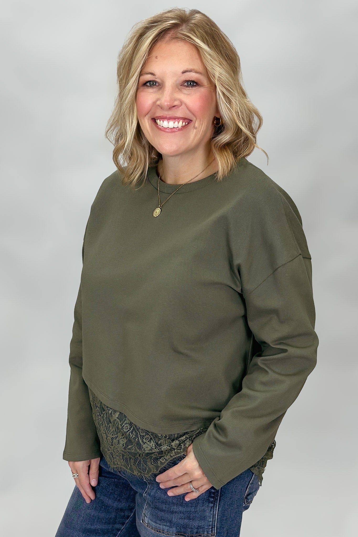 Entro army green long sleeve top with dropped shoulders and lace hem detail