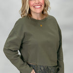 Army green Entro top showing crew neckline and layered lace hem