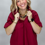Entro Big Sun wine pleated V-neck blouse, front view