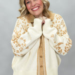 Staccato oatmeal and tan floral jacquard button-front cardigan; front model view.