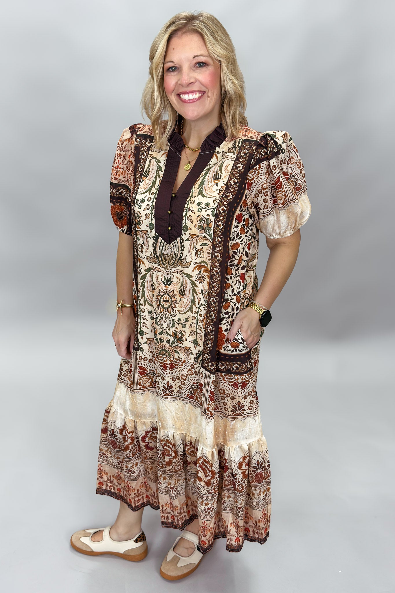 Blown My Cover cream paisley midi dress in a relaxed front pose, with short sleeves, contrasting dark neckline, tiered hem, and beige flat sandals.