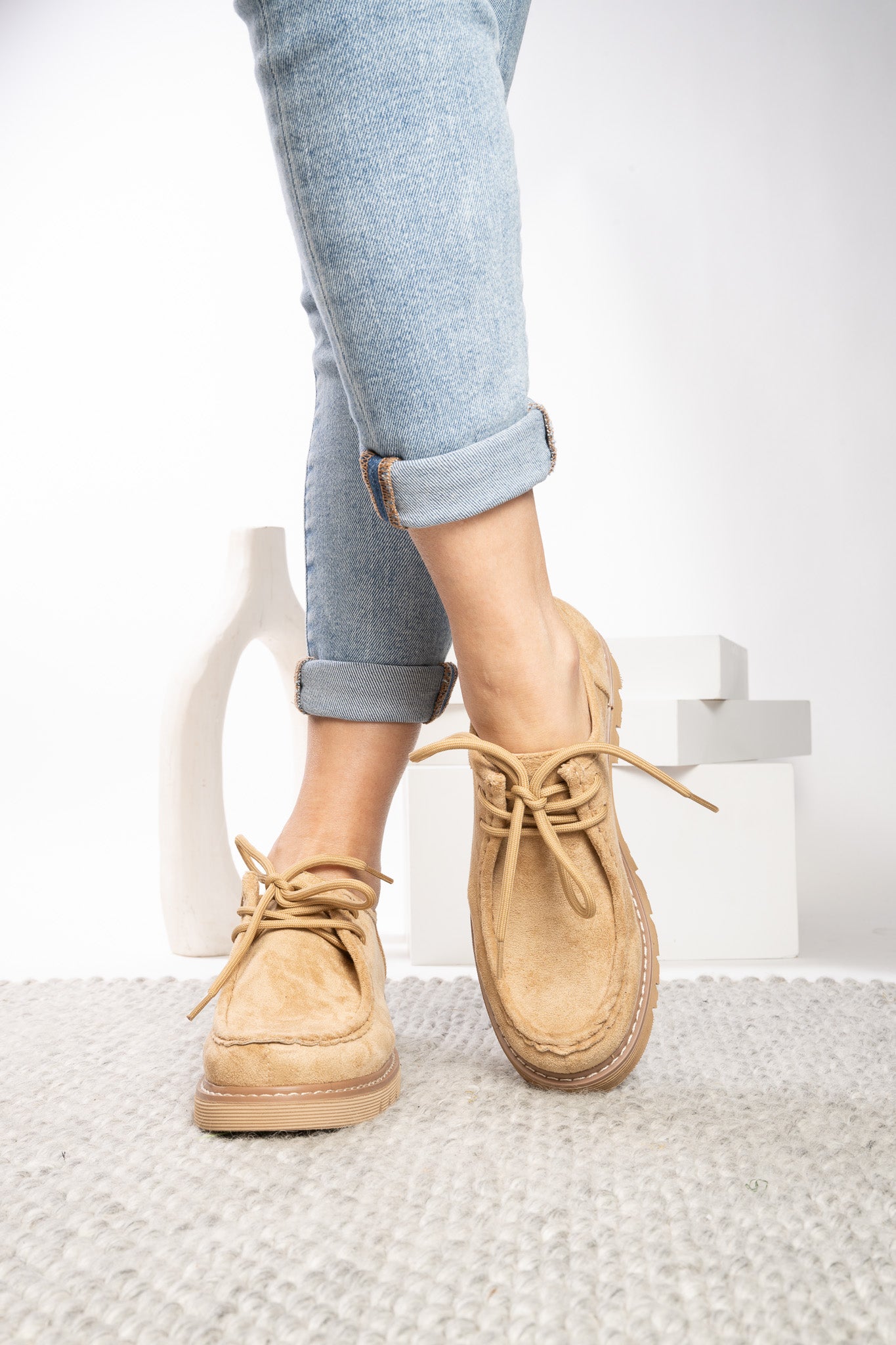 Close view of Corkys Fall For It camel moc-toe stitching and lace-up detail
