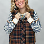 Staccato navy and brown plaid vest with mock neck and patch pockets; styling suggestion over a separate striped sweater.