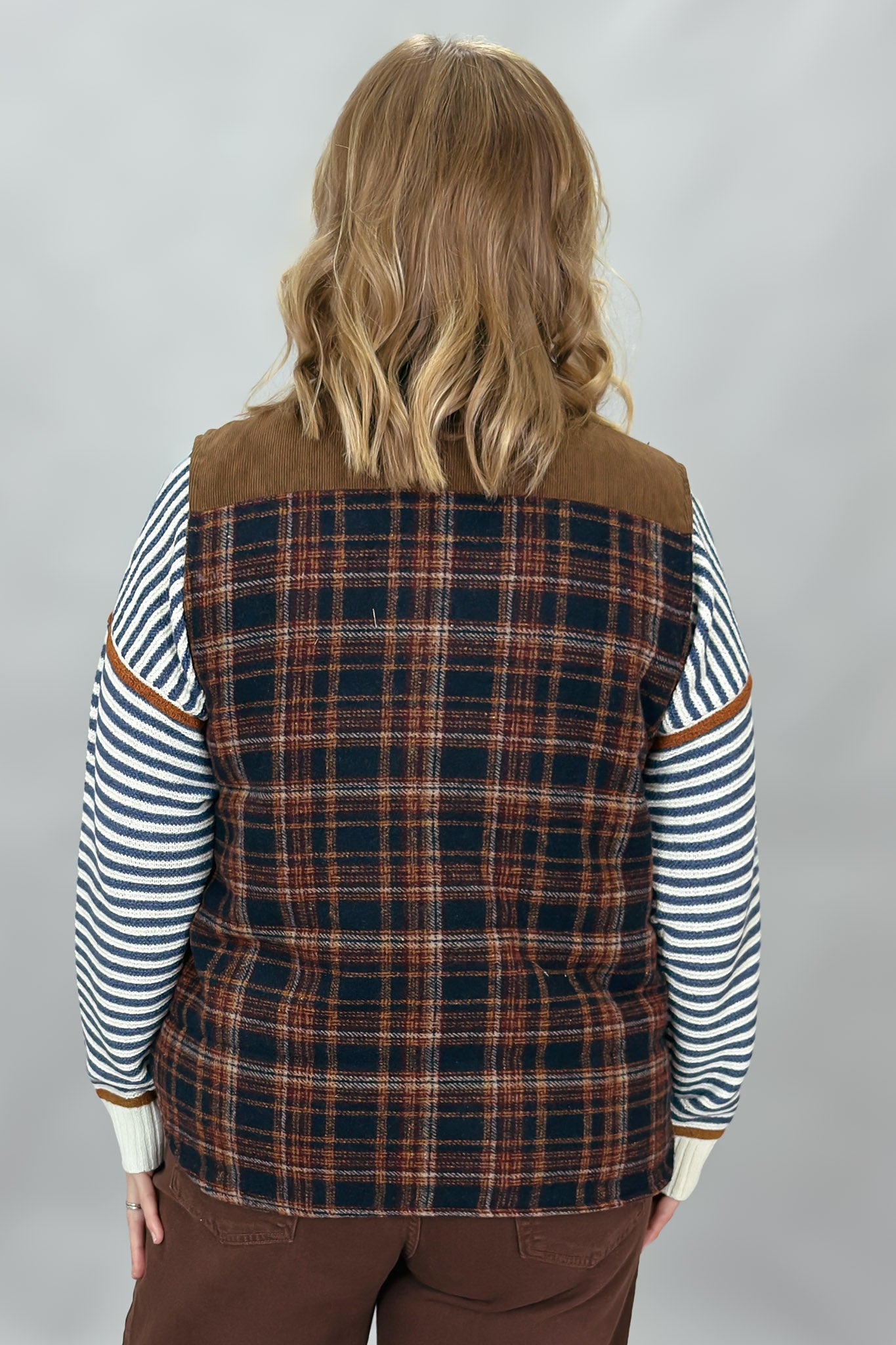 Staccato navy and brown plaid vest with mock neck and patch pockets; back view.