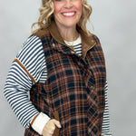 Staccato navy and brown plaid vest with mock neck and patch pockets; styling suggestion over a separate striped sweater.