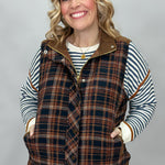 Staccato navy and brown plaid vest with mock neck and patch pockets; styling suggestion over a separate striped sweater.