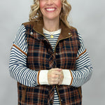Staccato navy and brown plaid vest with mock neck and patch pockets; styling suggestion over a separate striped sweater.