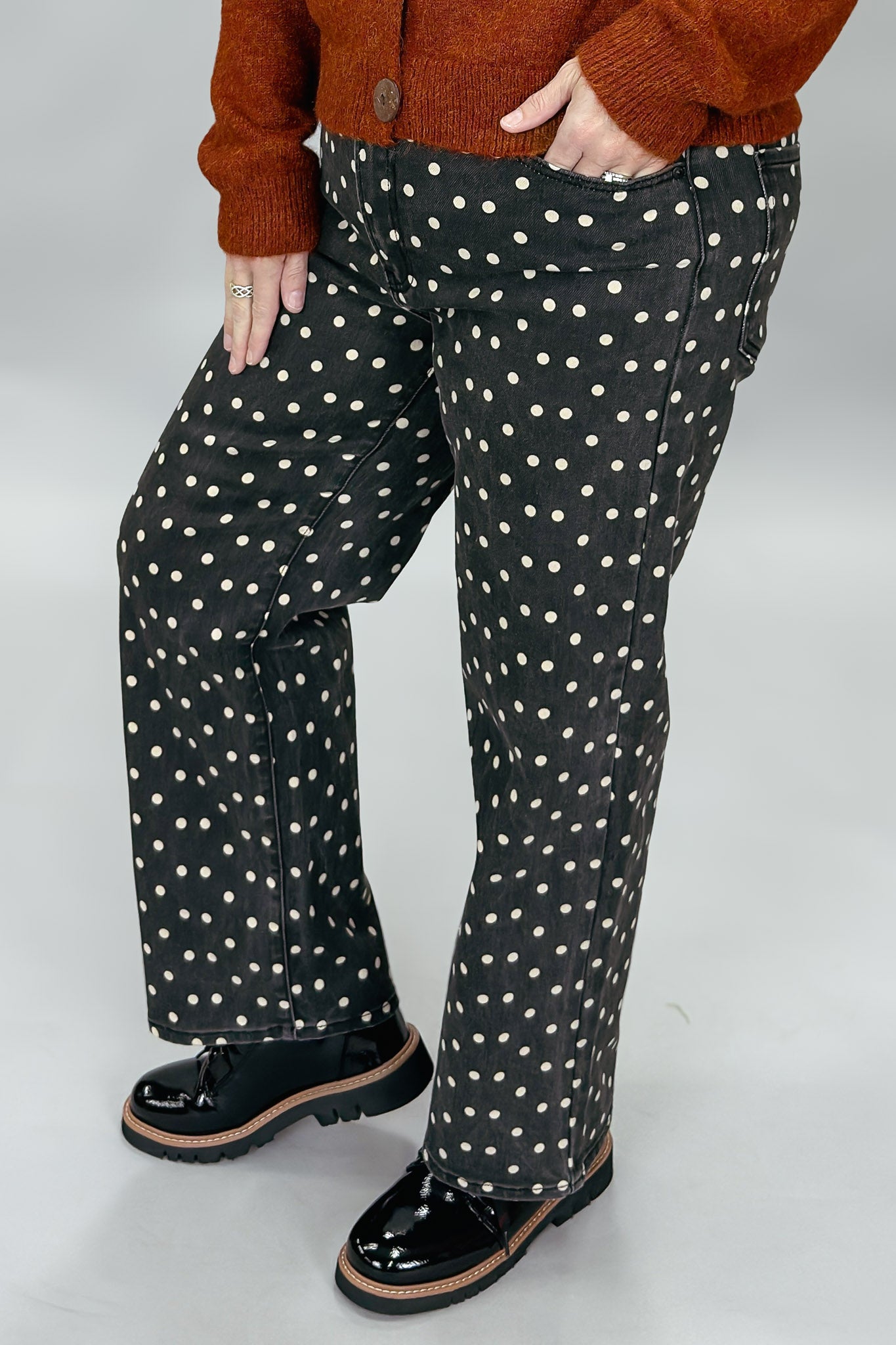 Just Black Denim black straight-leg jeans with cream polka dots; angled model view.