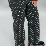Just Black Denim black straight-leg jeans with cream polka dots; front pocket and waistband detail.