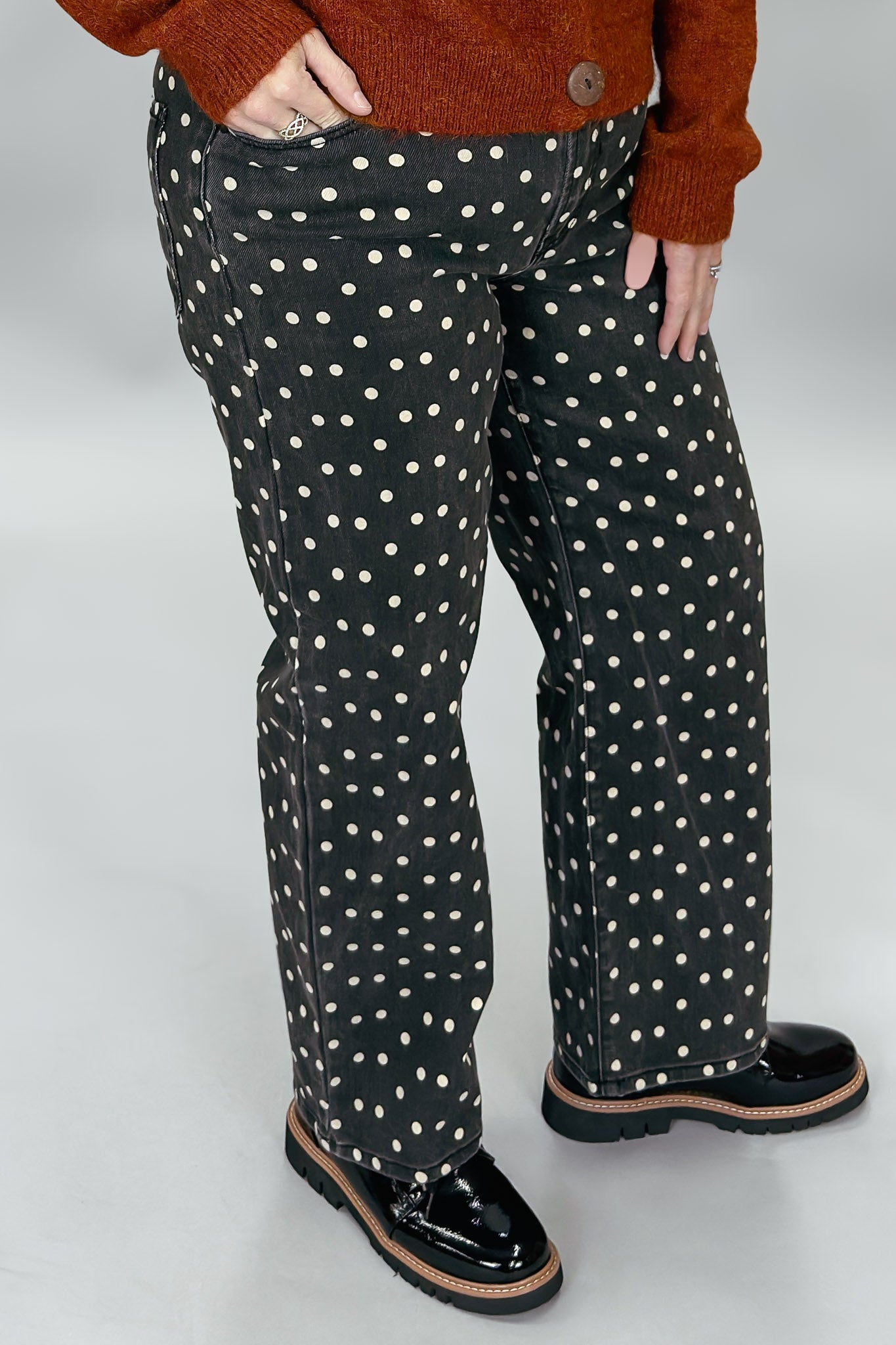 Just Black Denim black straight-leg jeans with cream polka dots; front pocket and waistband detail.