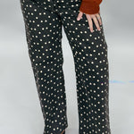 Just Black Denim black straight-leg jeans with cream polka dots; angled model view.
