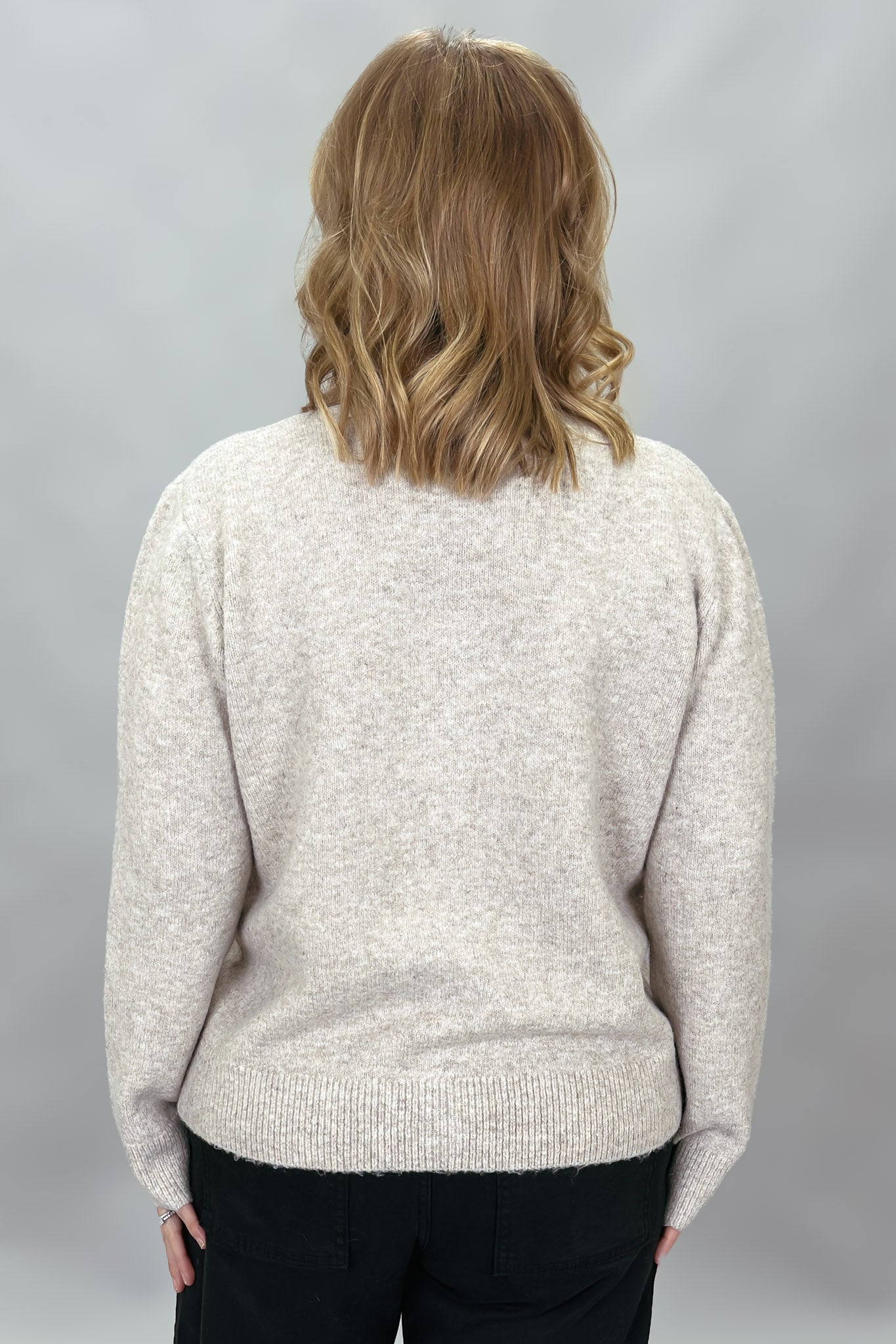 Compania Fantastica tan button-front cardigan with bow details; back view.