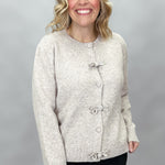 Compania Fantastica tan button-front cardigan with bow details; front model view.