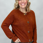 Compania Fantastica rust crewneck button-front cardigan; angled model view.