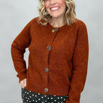 Compania Fantastica rust crewneck button-front cardigan; front model view.