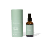 Hico Candle Co. Rouge room spray amber-colored bottle beside a green tube