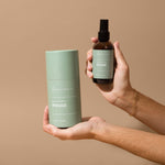 Hico Candle Co. Rouge room spray bottle and green tube held for a closer view