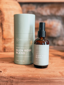 Hico Candle Co. Glen Rose Blend room spray in an amber-colored bottle beside a green tube
