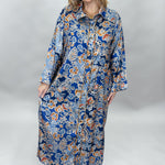 Uncle Frank blue floral satin midi dress with collar and waist tie; front model view.