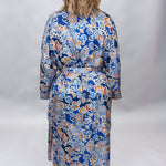 Uncle Frank blue floral satin midi dress with collar and waist tie; back view.