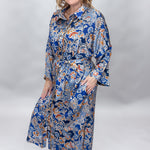 Uncle Frank blue floral satin midi dress with collar and waist tie; angled model view.