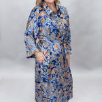 Uncle Frank blue floral satin midi dress with collar and waist tie; front model view.