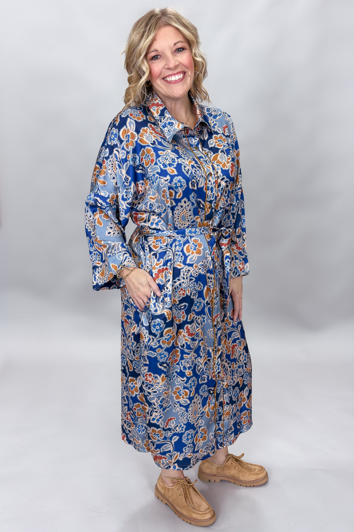Uncle Frank blue floral satin midi dress with collar and waist tie; front model view.