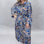 Uncle Frank blue floral satin midi dress with collar and waist tie; front model view.