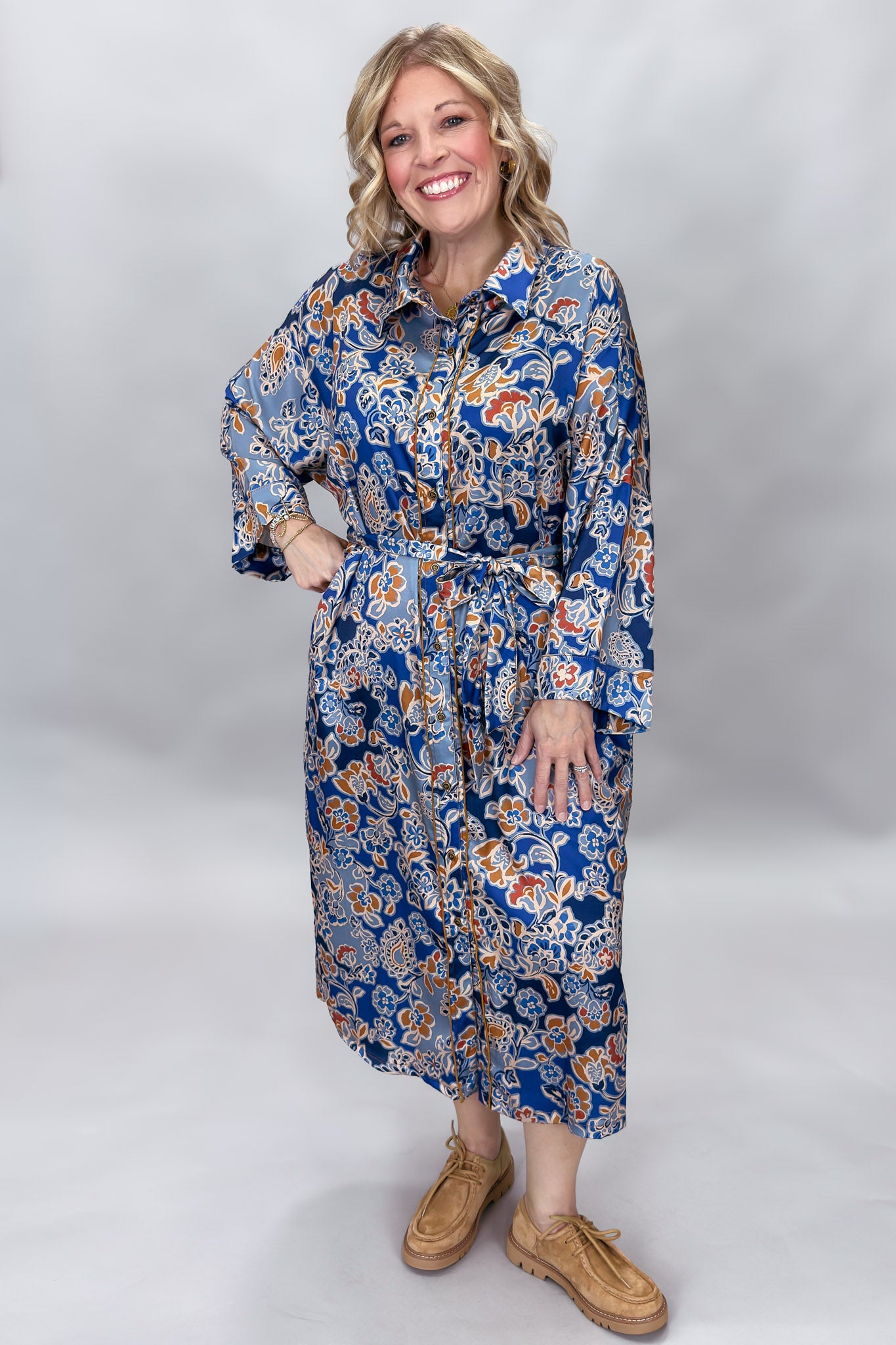 Uncle Frank blue floral satin midi dress with collar and waist tie; front model view.