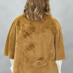 Ivy Jane camel faux fur cape with concealed snaps and patch pockets; back view.