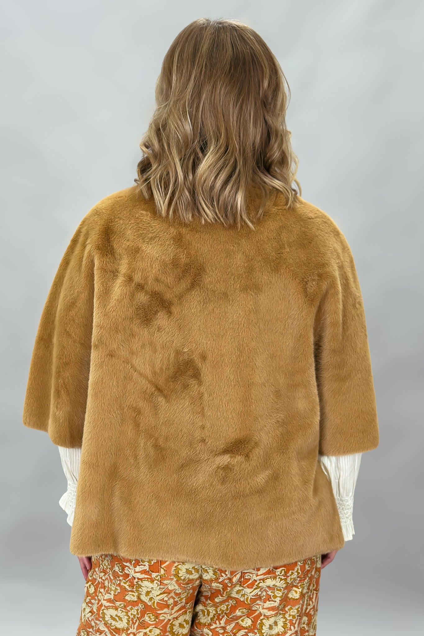 Ivy Jane camel faux fur cape with concealed snaps and patch pockets; back view.