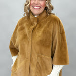 Ivy Jane camel faux fur cape with concealed snaps and patch pockets; front model view.