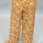 Ivy Jane orange, cream and green floral wide-leg pants; back view.