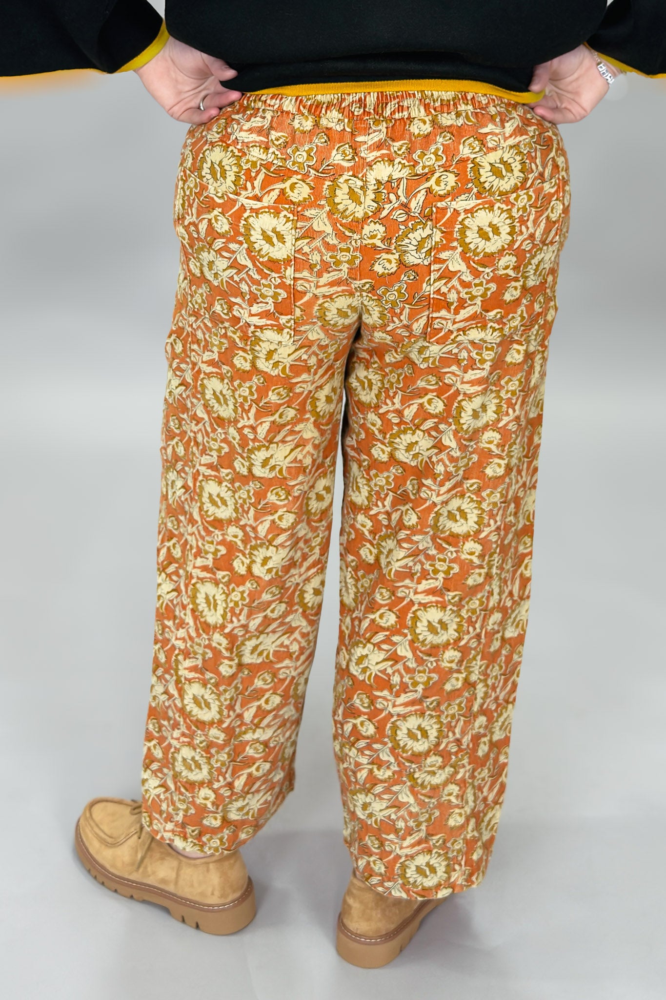 Ivy Jane orange, cream and green floral wide-leg pants; back view.