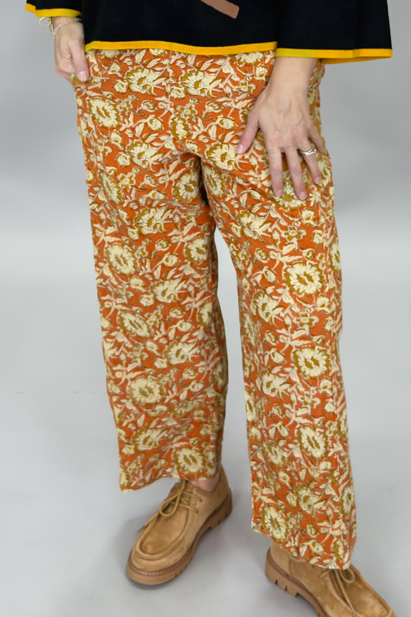 Ivy Jane orange, cream and green floral wide-leg pants; front model view.