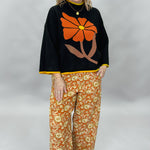 Ivy Jane orange, cream and green floral wide-leg pants; outfit styling suggestion.