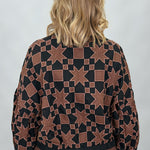 Ivy Jane black quilted jacket with brown stars and squares; back view.