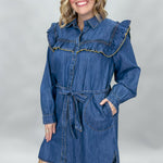 Ivy Jane blue denim mini dress with ruffled yoke and waist tie; angled model view.