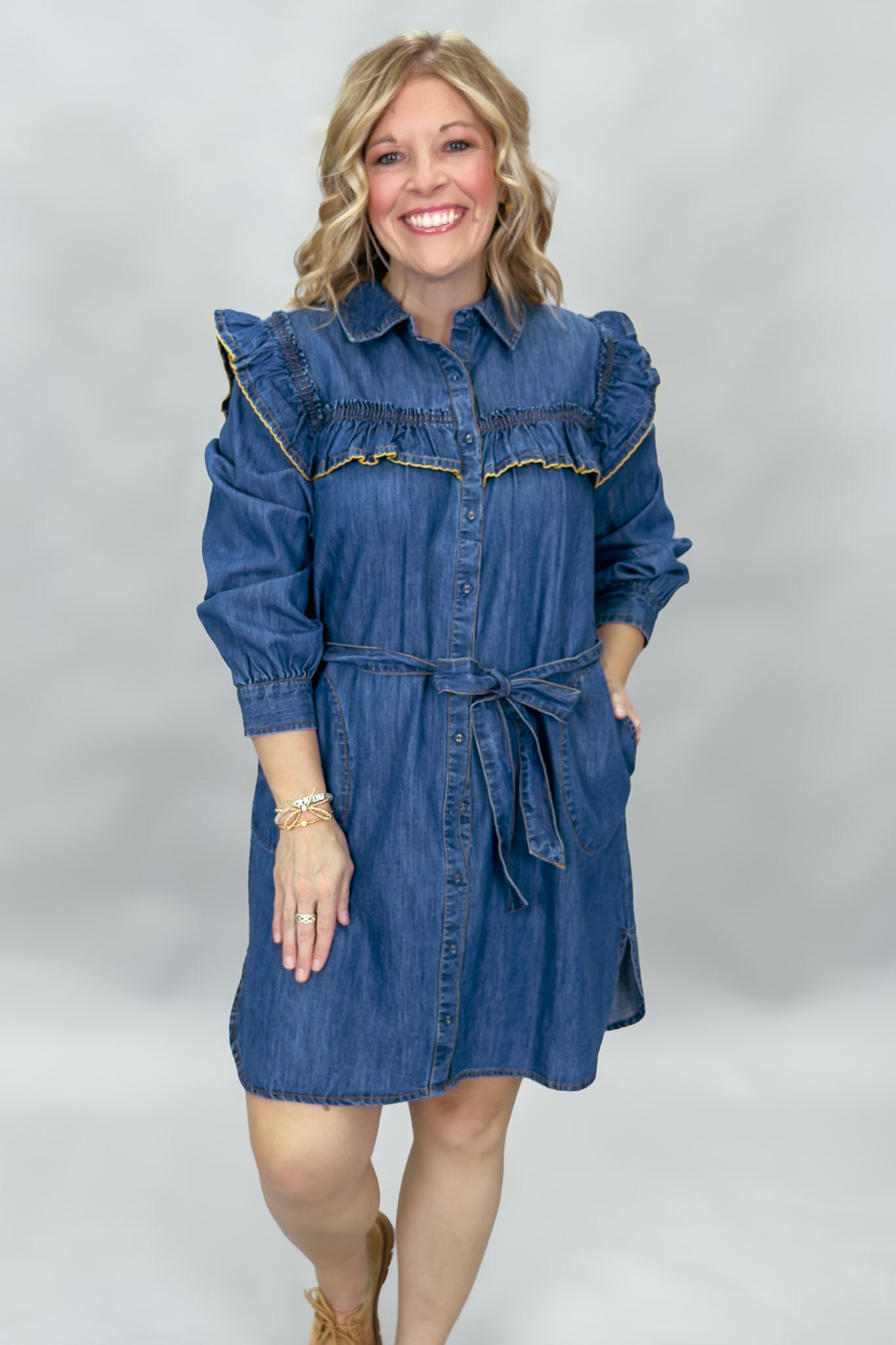 Ivy Jane blue denim mini dress with ruffled yoke and waist tie; front view with sleeves pushed up.