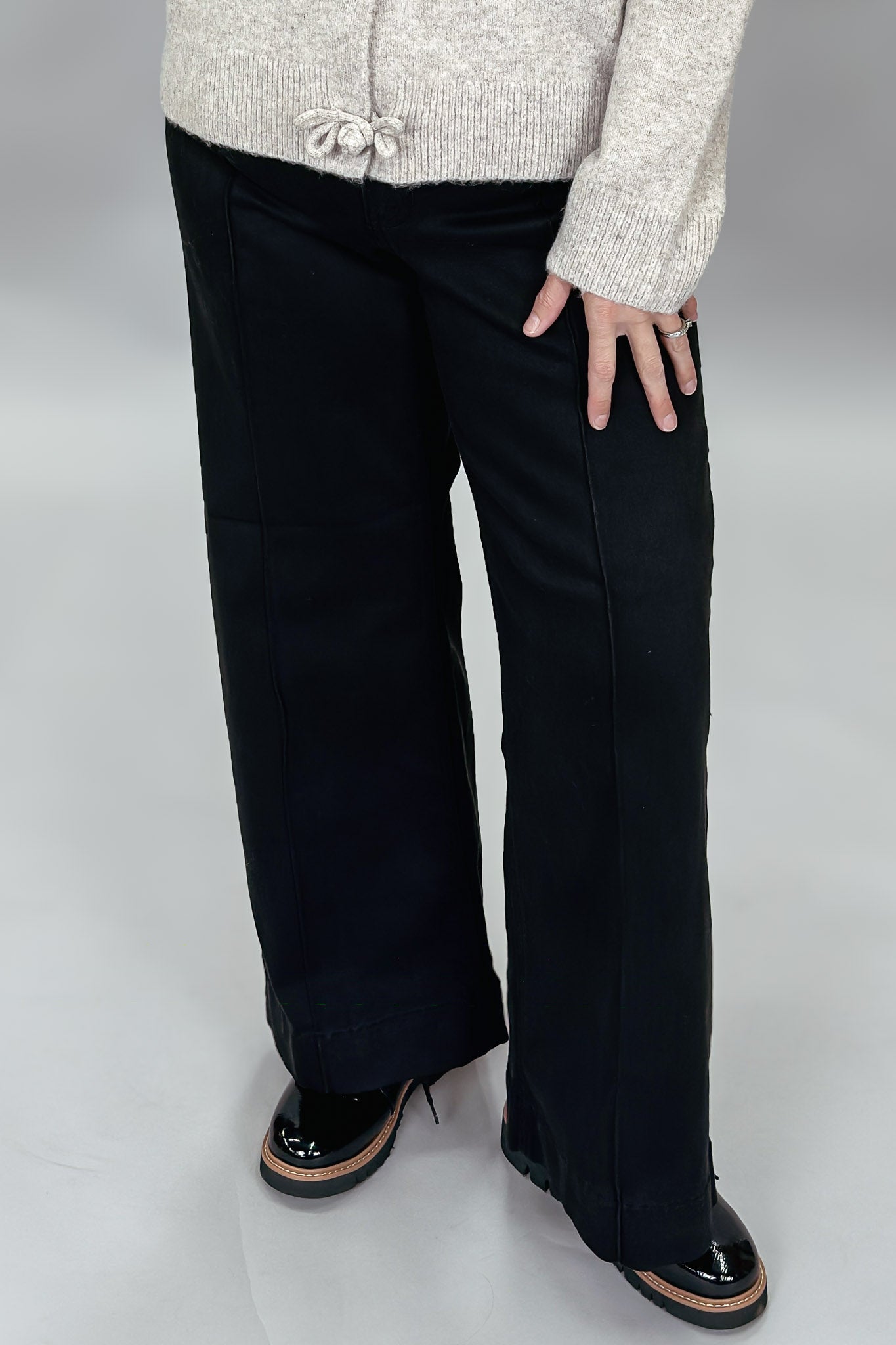 Just Black Denim black wide-leg jeans with front seam detail; front model view.