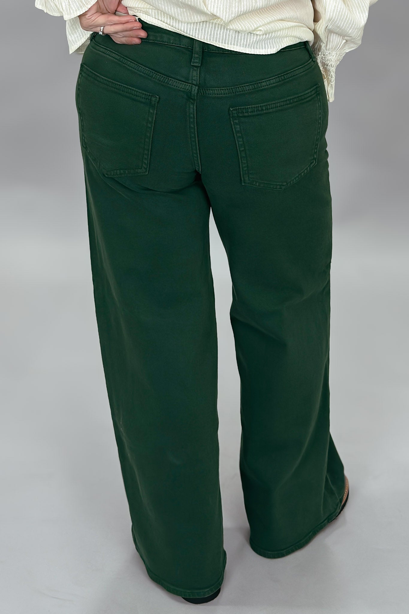 Just USA forest green straight-leg jeans with front and back pockets; back view.