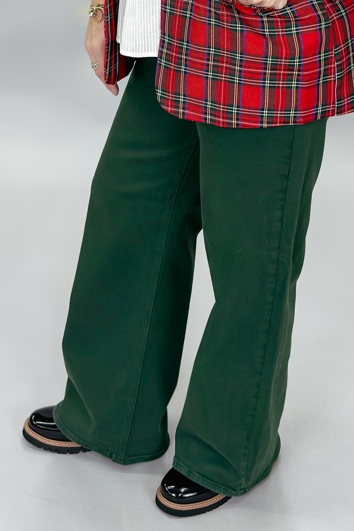 Just USA forest green straight-leg jeans with front and back pockets; angled model view.