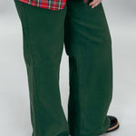 Just USA forest green straight-leg jeans with front and back pockets; angled model view.